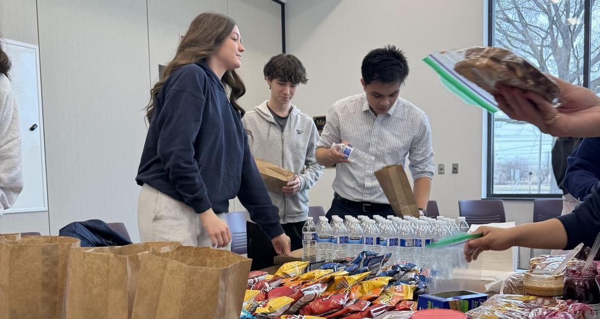 Kutoa Foundation members donating supplies