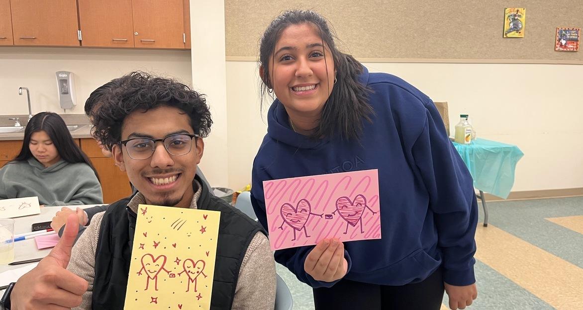 Kutoa volunteers making cards together at a table